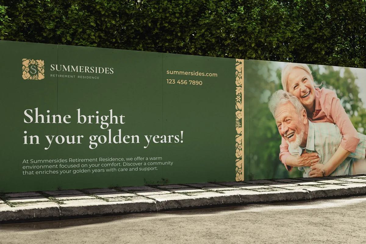 Construction hoarding for a retirement residence: serif headline, floral monogram and a laughing couple